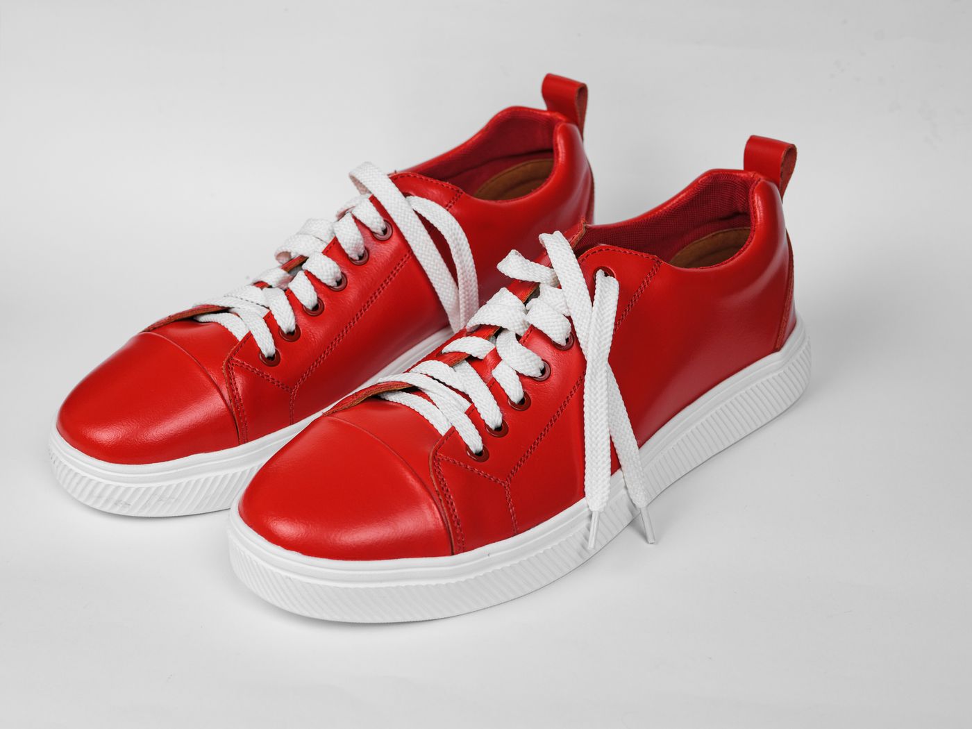 Unbranded lightweight trainers photographed in a studio